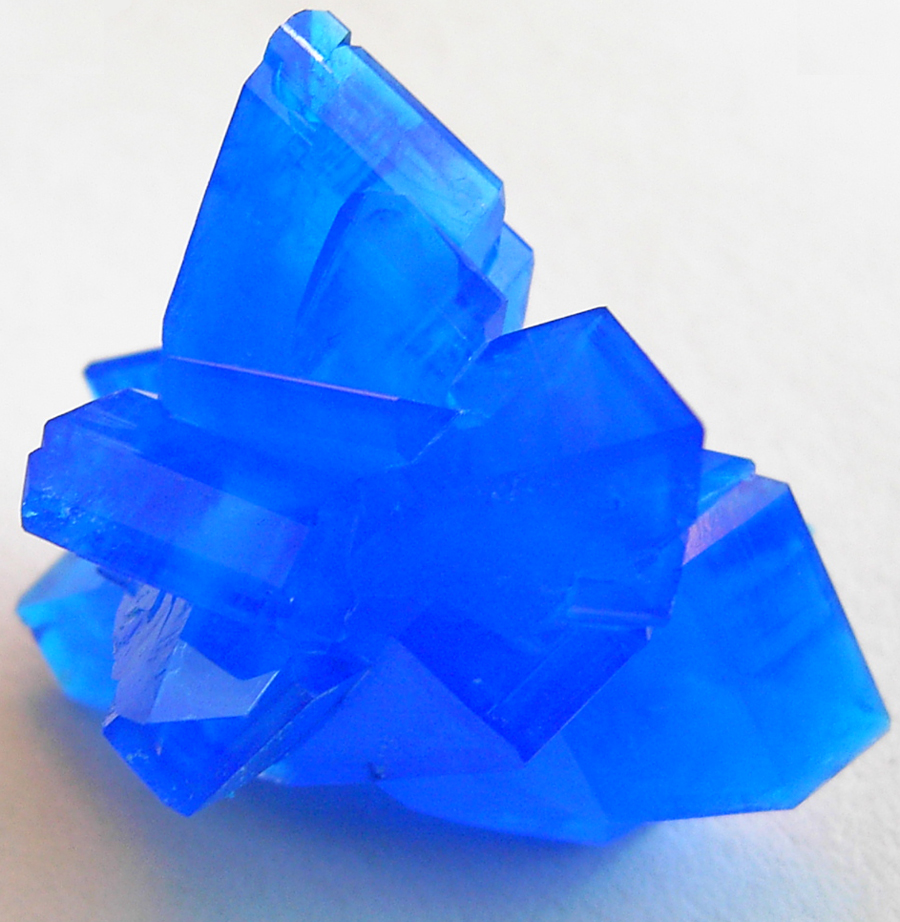 Vivid blue copper sulfate crystals representing copper peptides